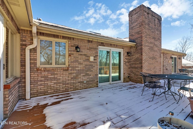 view of snow covered deck