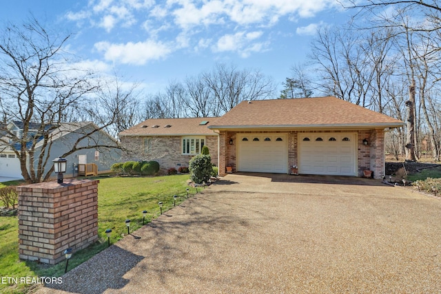 144 Greenwood Rd, Crossville, TN 38558 - view of front of property featuring driveway, brick siding, a front lawn, and a shingled roof
