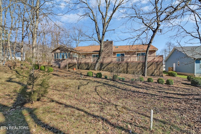 144 Greenwood Rd, Crossville, TN 38558 - rear view of house with a chimney and a deck