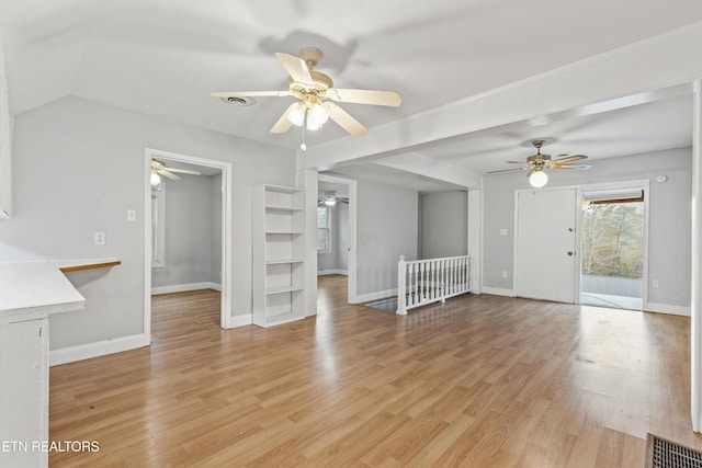 unfurnished living room with ceiling fan and light hardwood / wood-style floors