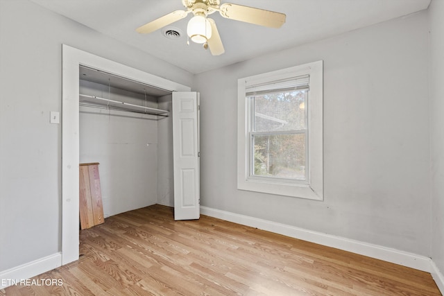 unfurnished bedroom with a closet, ceiling fan, and light hardwood / wood-style flooring