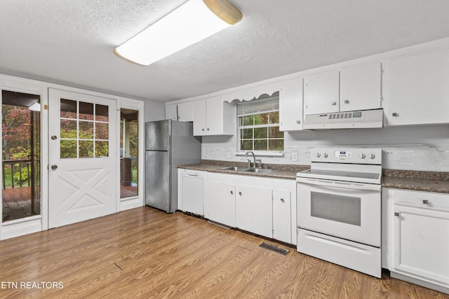 kitchen with sink, white cabinetry, a textured ceiling, white appliances, and light wood-type flooring