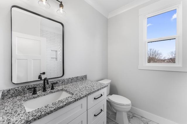 bathroom featuring toilet and vanity