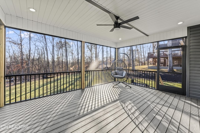 sunroom / solarium featuring ceiling fan