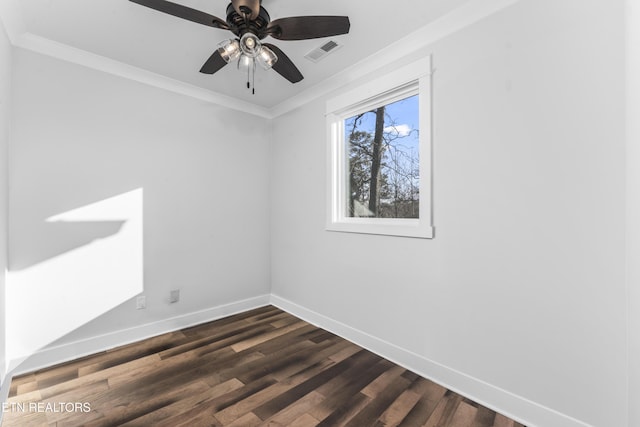 empty room featuring ceiling fan, dark wood-type flooring, and ornamental molding