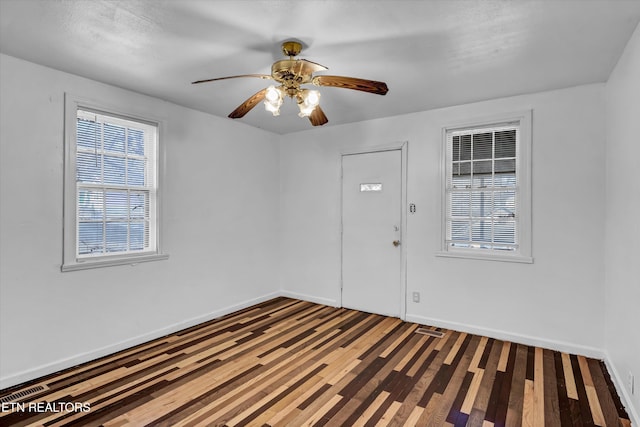 unfurnished room featuring ceiling fan