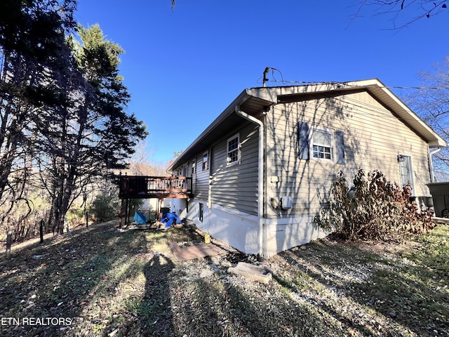 view of home's exterior with a deck