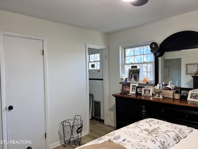 bedroom with hardwood / wood-style floors