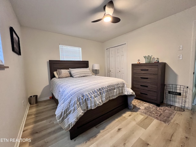 bedroom with a closet, ceiling fan, and hardwood / wood-style flooring