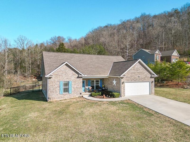 view of front of home featuring a front lawn and a garage