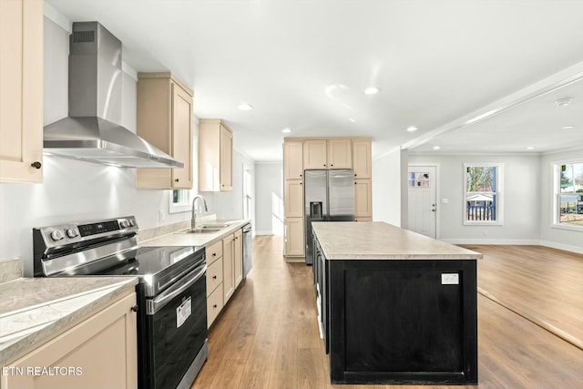 169 Dode St, Sweetwater, TN 37874 - kitchen featuring wall chimney exhaust hood, appliances with stainless steel finishes, a sink, cream cabinets, and a center island