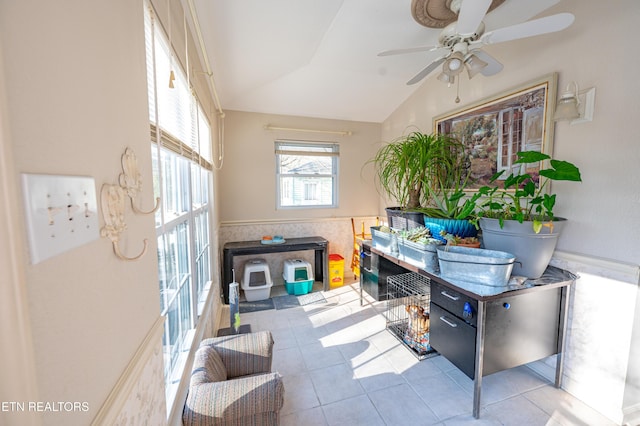 interior space with vaulted ceiling and ceiling fan