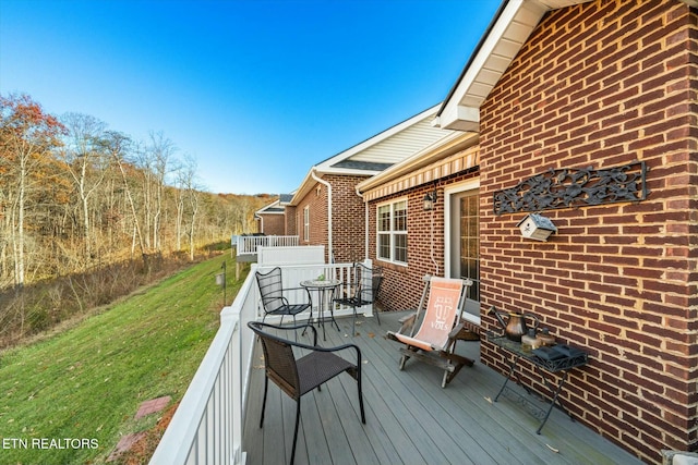 deck featuring a lawn