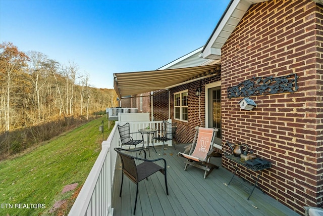 deck featuring a lawn