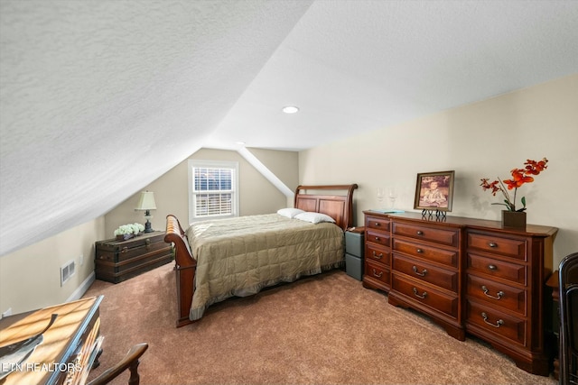 bedroom with light colored carpet, a textured ceiling, and lofted ceiling