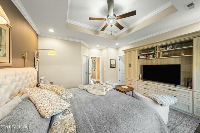 bedroom featuring ceiling fan, ornamental molding, and a raised ceiling