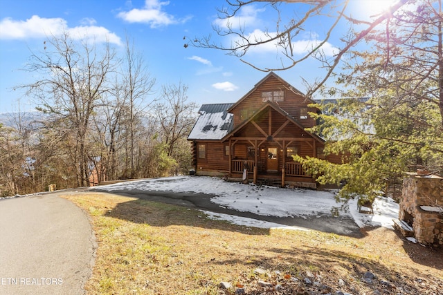 cabin featuring a porch