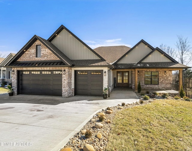 craftsman house with a garage and a front lawn