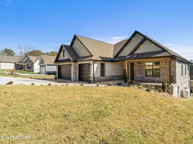 view of front of home with a front lawn and a garage