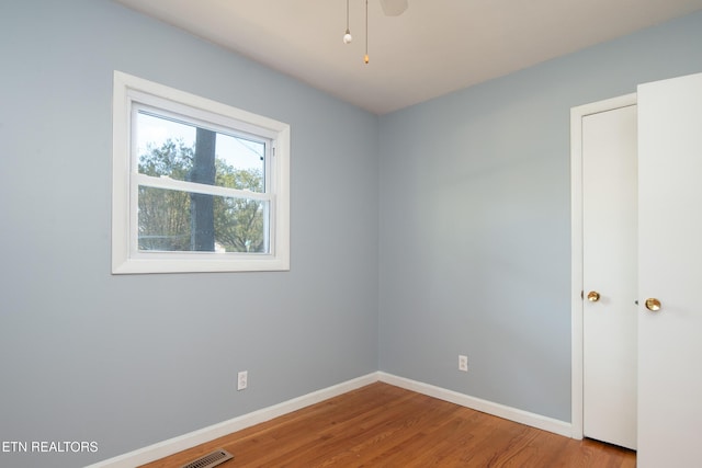 spare room featuring light wood-type flooring