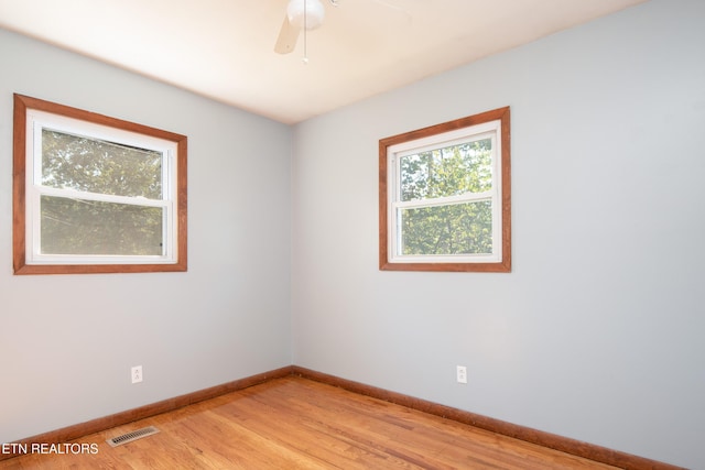 unfurnished room with light hardwood / wood-style floors and ceiling fan