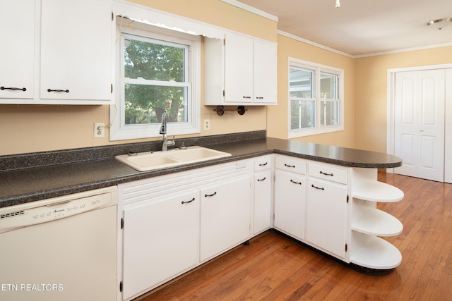 kitchen featuring dishwasher, dark wood-type flooring, white cabinetry, sink, and kitchen peninsula