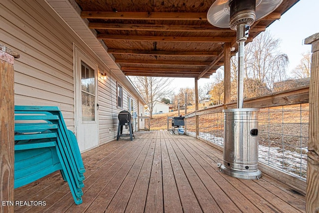 wooden terrace featuring a grill