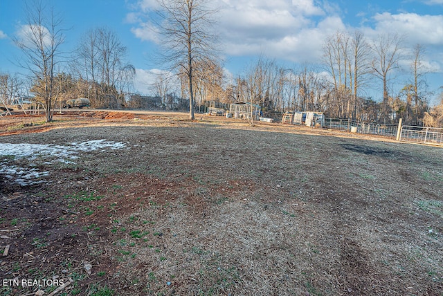 view of yard with a rural view