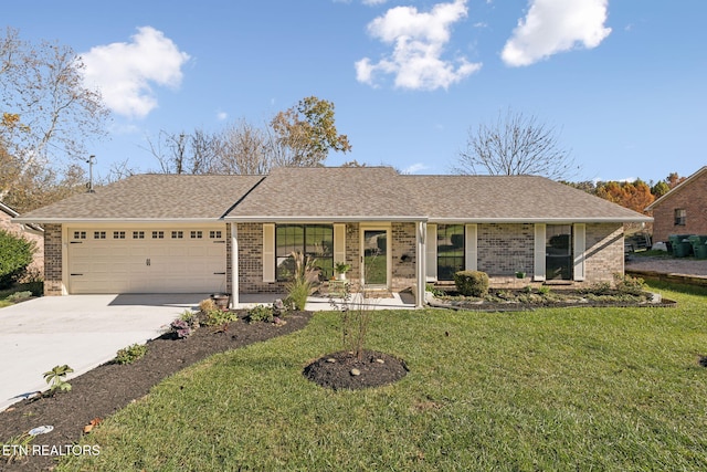 ranch-style house with a garage and a front yard