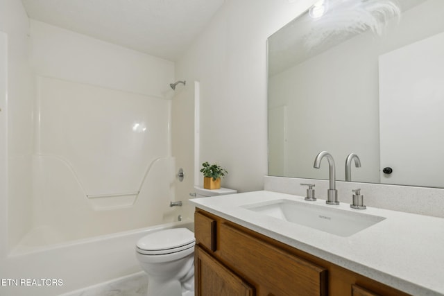 full bathroom with vanity, bathtub / shower combination, and toilet