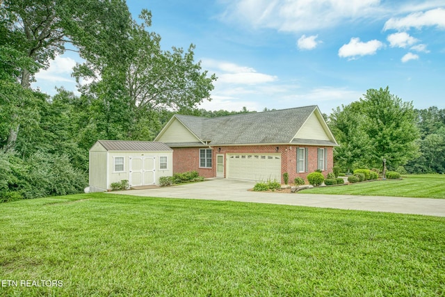 view of front of property with a garage and a front lawn