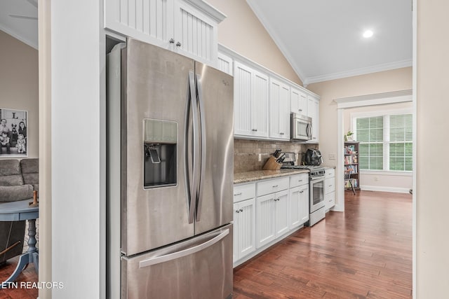 kitchen featuring decorative backsplash, light stone counters, white cabinets, and stainless steel appliances