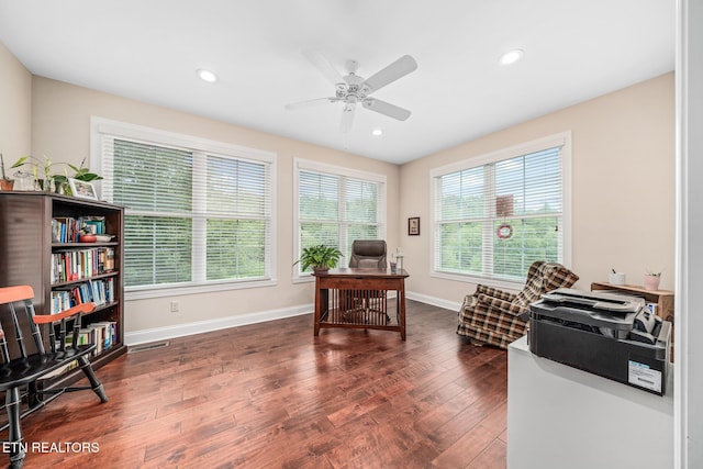 office with ceiling fan and dark hardwood / wood-style flooring