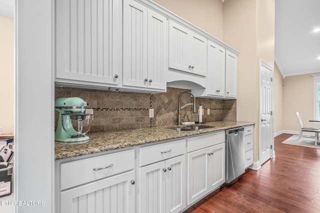 kitchen featuring white cabinetry, dark wood-type flooring, stone countertops, stainless steel dishwasher, and sink