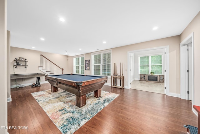 game room featuring billiards, dark hardwood / wood-style flooring, and a wealth of natural light