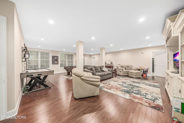 living room with dark wood-type flooring and pool table