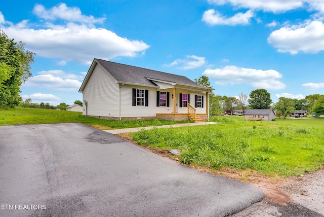 view of front of property featuring crawl space, covered porch, and a shingled roof