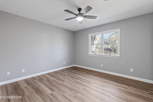 unfurnished room with ceiling fan and light hardwood / wood-style flooring