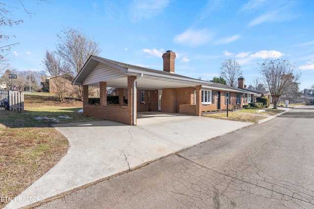 view of front of home with a carport