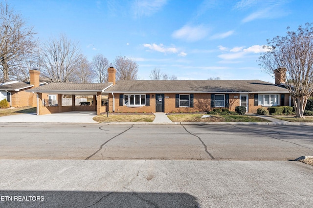 ranch-style home with a carport