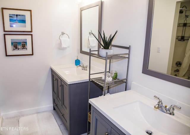 bathroom featuring shower / tub combination and vanity