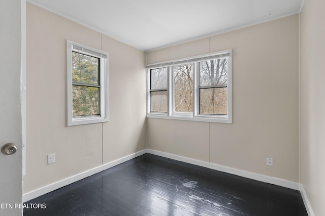 unfurnished room featuring dark wood-type flooring