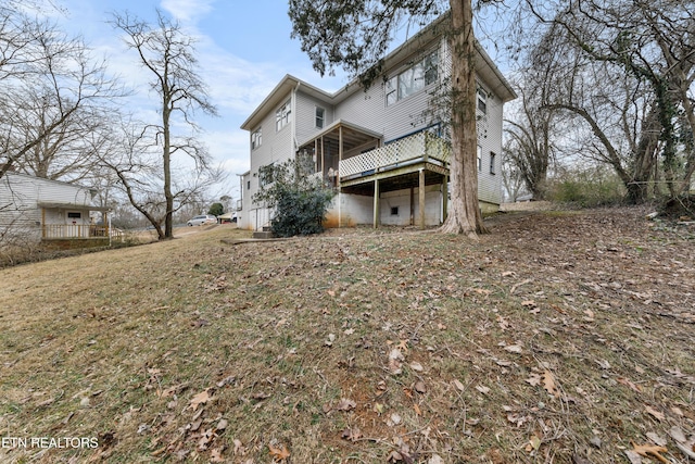 back of property featuring a wooden deck