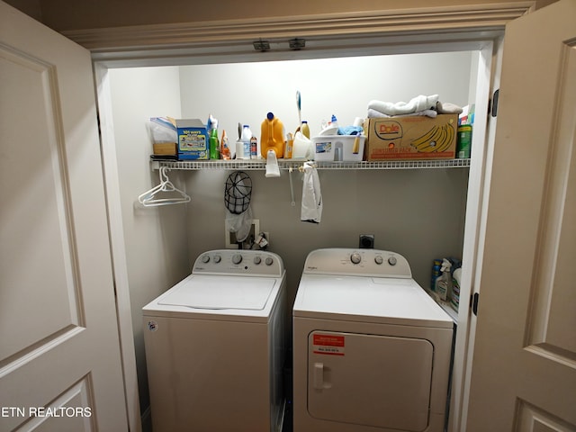 washroom with washer and dryer