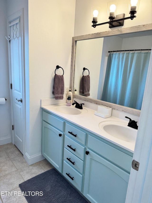 bathroom featuring tile patterned floors and vanity