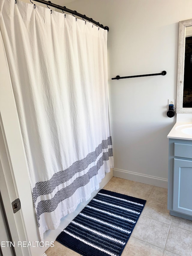 bathroom featuring vanity and tile patterned flooring