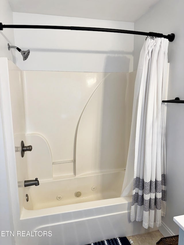 bathroom with shower / tub combo with curtain and tile patterned flooring