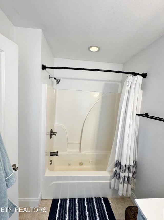 bathroom with vanity, tile patterned flooring, and shower / bath combo with shower curtain