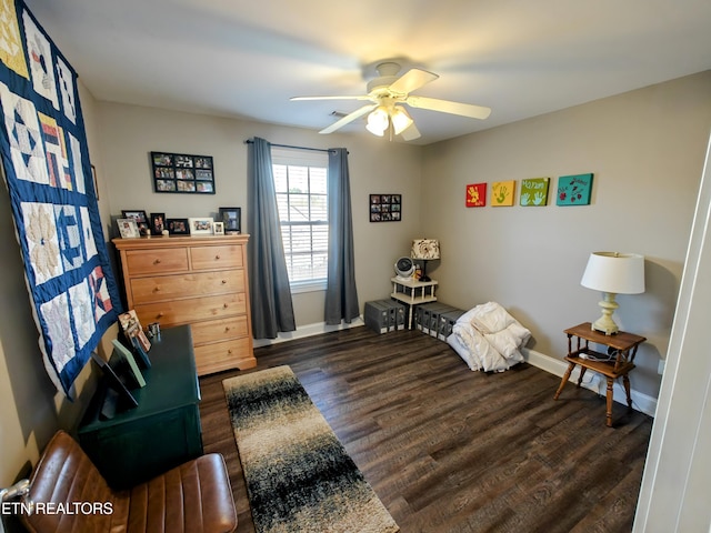 bedroom featuring ceiling fan and dark hardwood / wood-style flooring