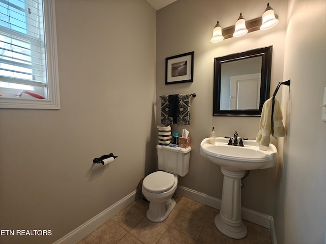 bathroom with tile patterned floors and toilet